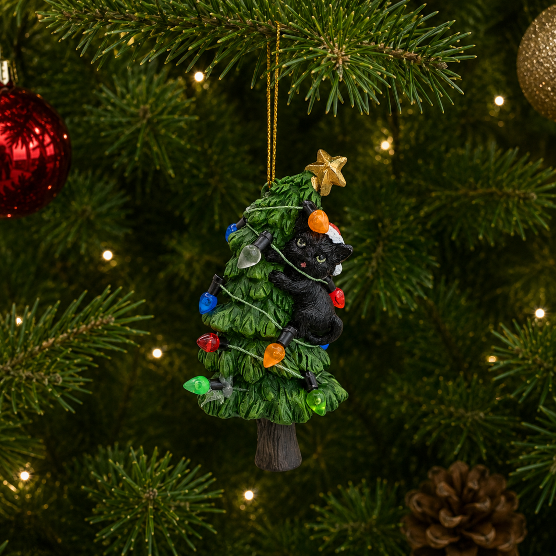 Black Cat Knocking Down Tree Wrapped in Lights